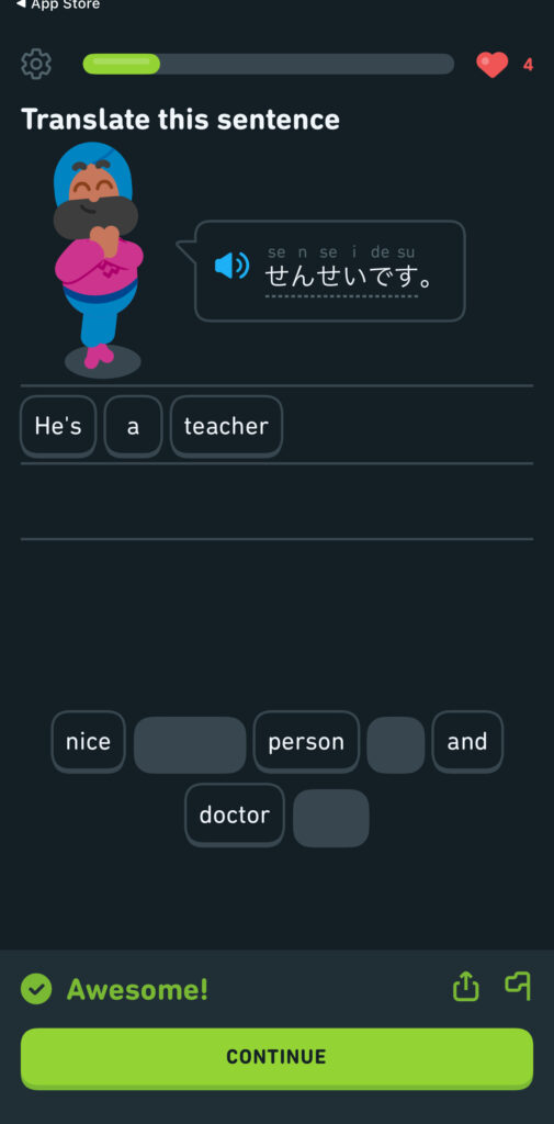 A Duolingo app lesson screen prompting the user to translate the Japanese sentence “せんせいです” (sensei desu). The phrase translates to “He’s a teacher,” which is selected using draggable word tiles at the bottom of the screen. The character, a bearded man in a blue outfit with a pink scarf, is smiling with his hands clasped. A green progress bar indicates partial completion of the lesson, and a green “Awesome!” banner appears at the bottom, above the “CONTINUE” button.