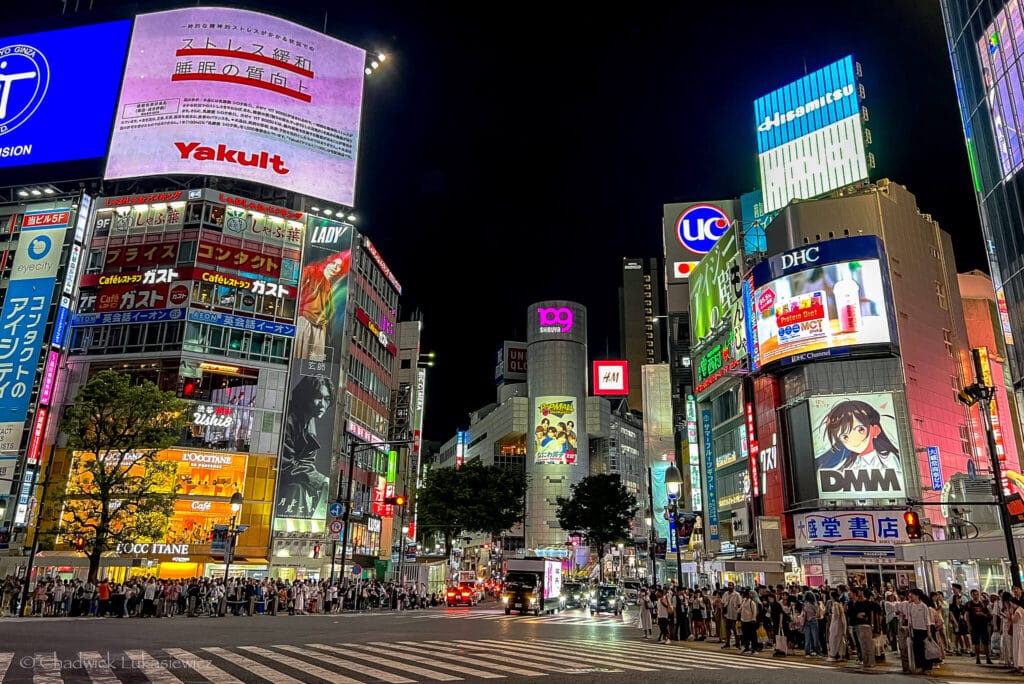 A neon-lit street in Akihabara, Tokyo, demonstrating how smartphone photography enables ADHD creatives to capture dynamic urban scenes with ease.