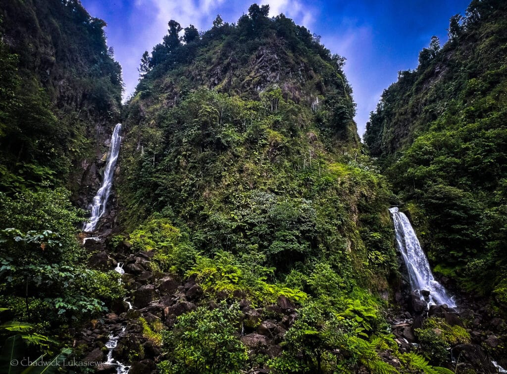 Twin waterfalls at Trafalgar Falls, Dominica, surrounded by lush greenery, highlighting mindful photography techniques for neurodivergent travelers.